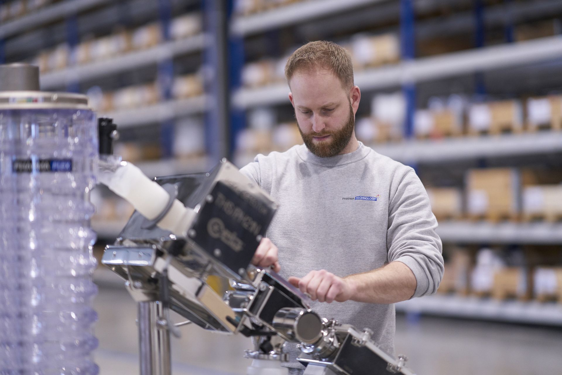 worker assembling metal detector